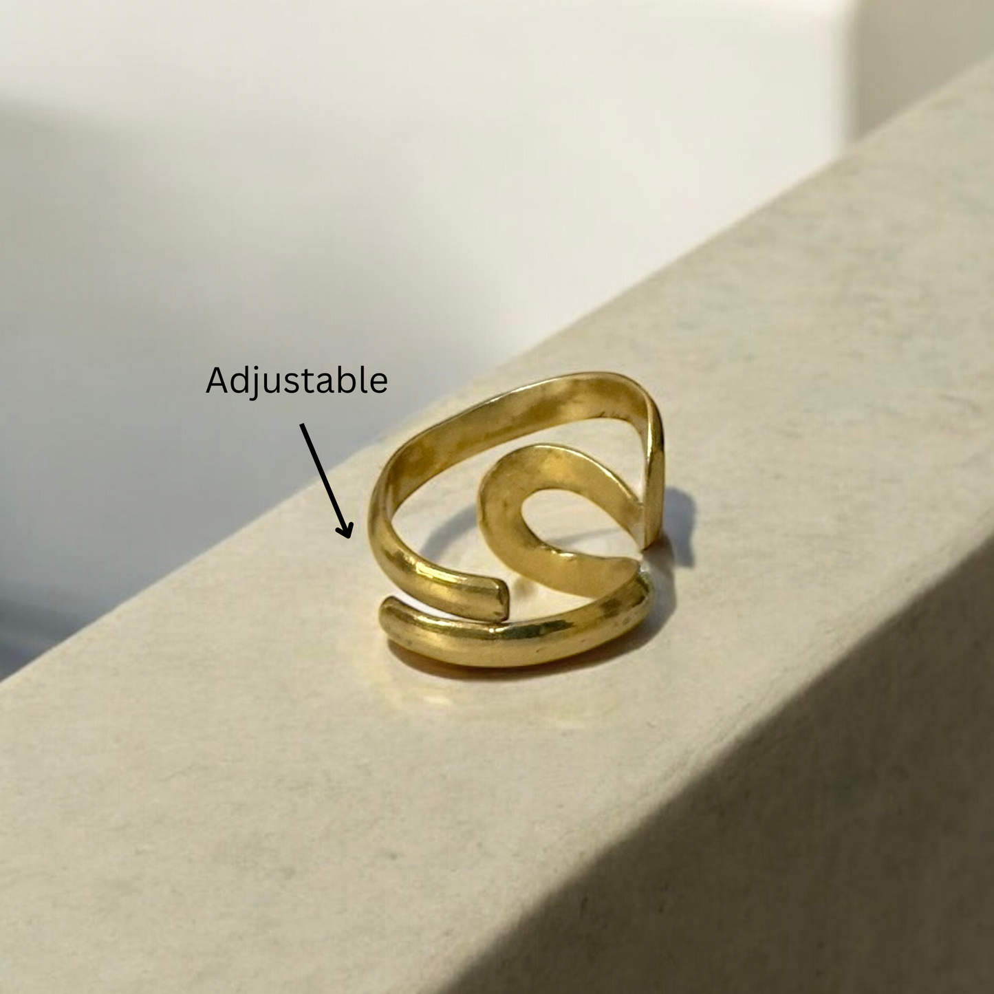 Domi - Handmade African brass curled ring