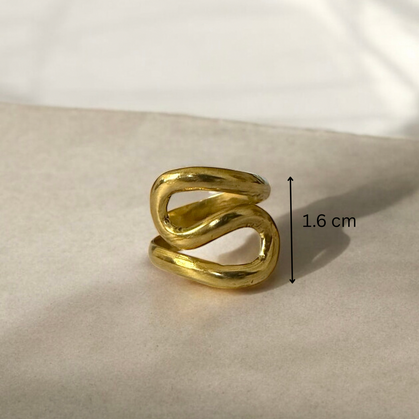Domi - Handmade African brass curled ring