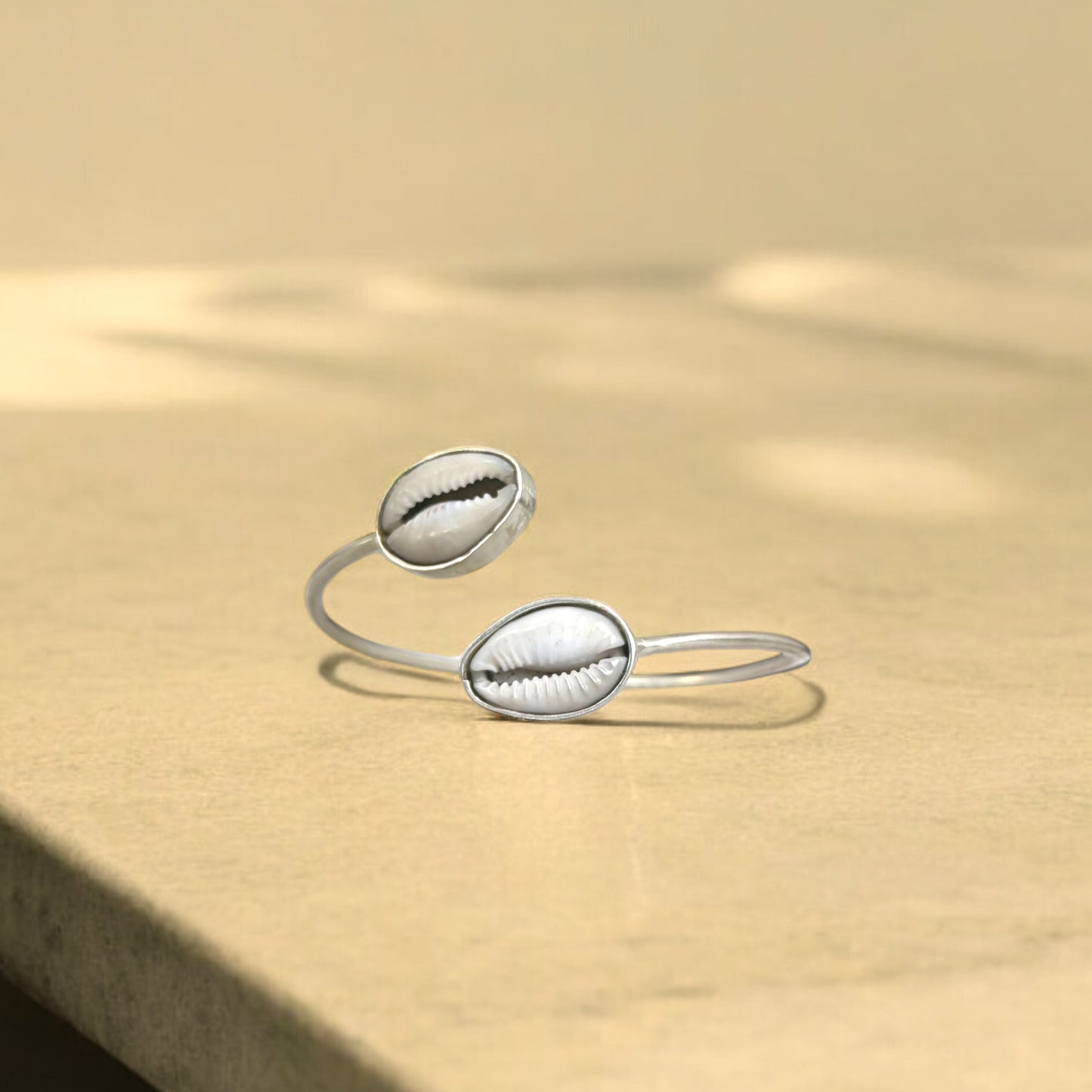 Dalla - Handmade brass bracelet with double Cowrie shells