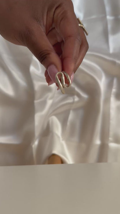 Domi - Handmade African brass curled ring
